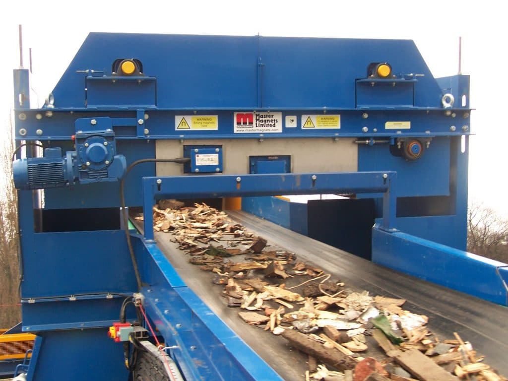 Electro overband magnets protect waste shredders