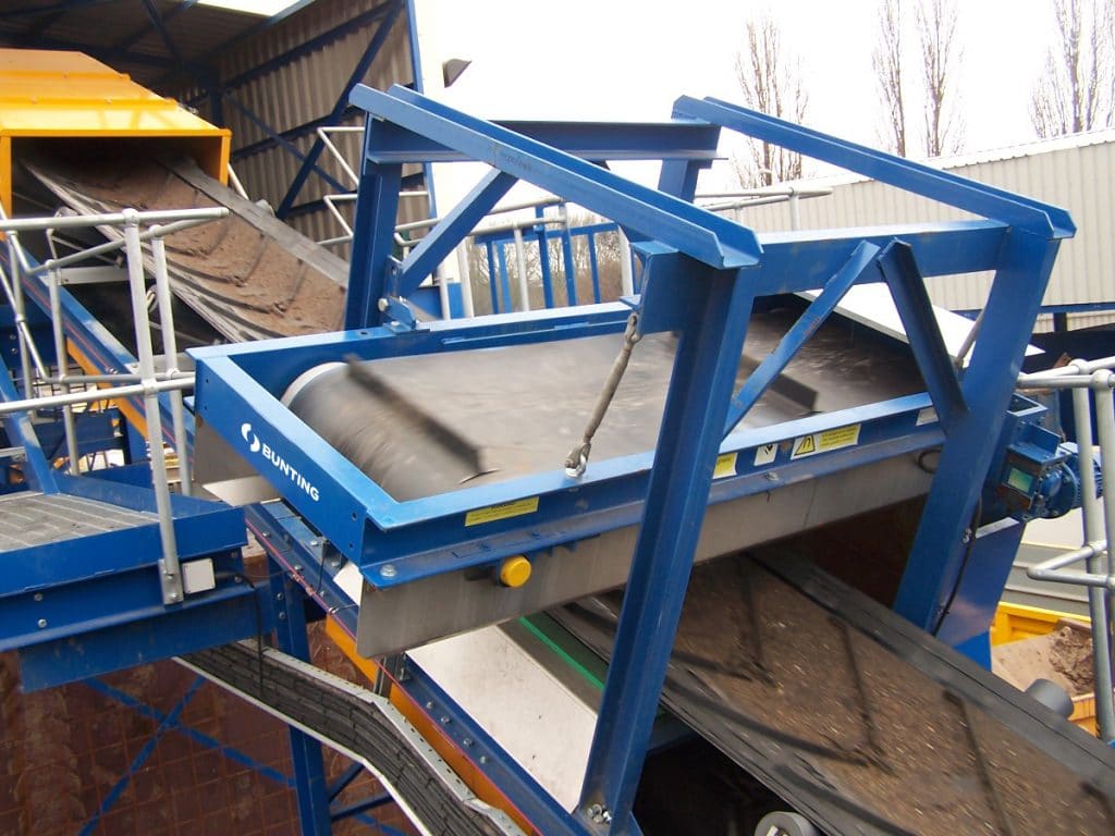 Overband magnet at processing plant