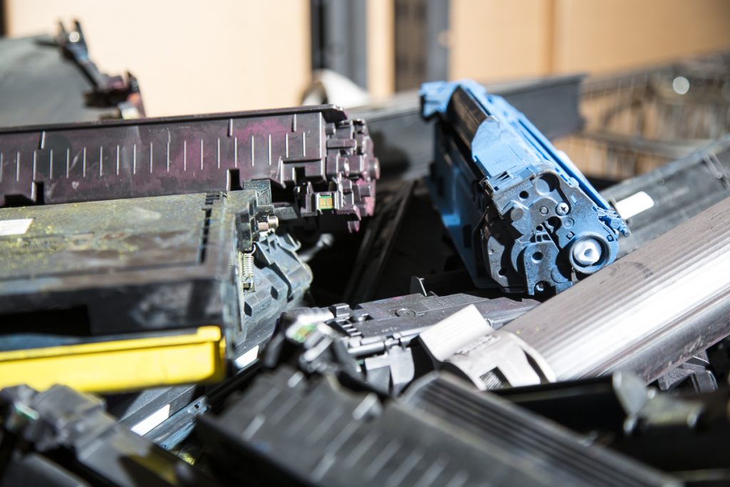 Separate metal from shredded ink toner cartridges