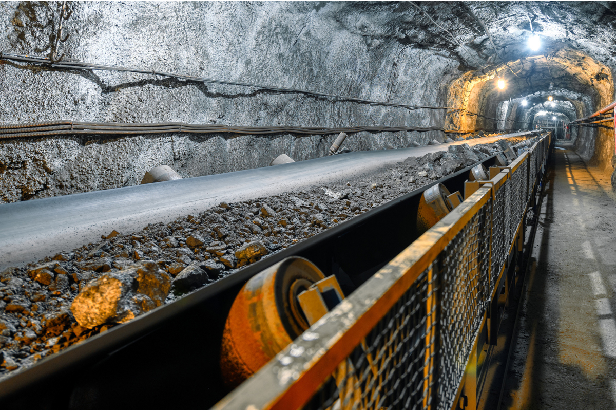 Belt conveyor in an underground mining tunnel Transportation of mineral ore to the surface